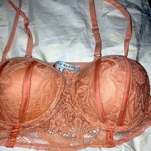 I am selling a pink cropped shirt